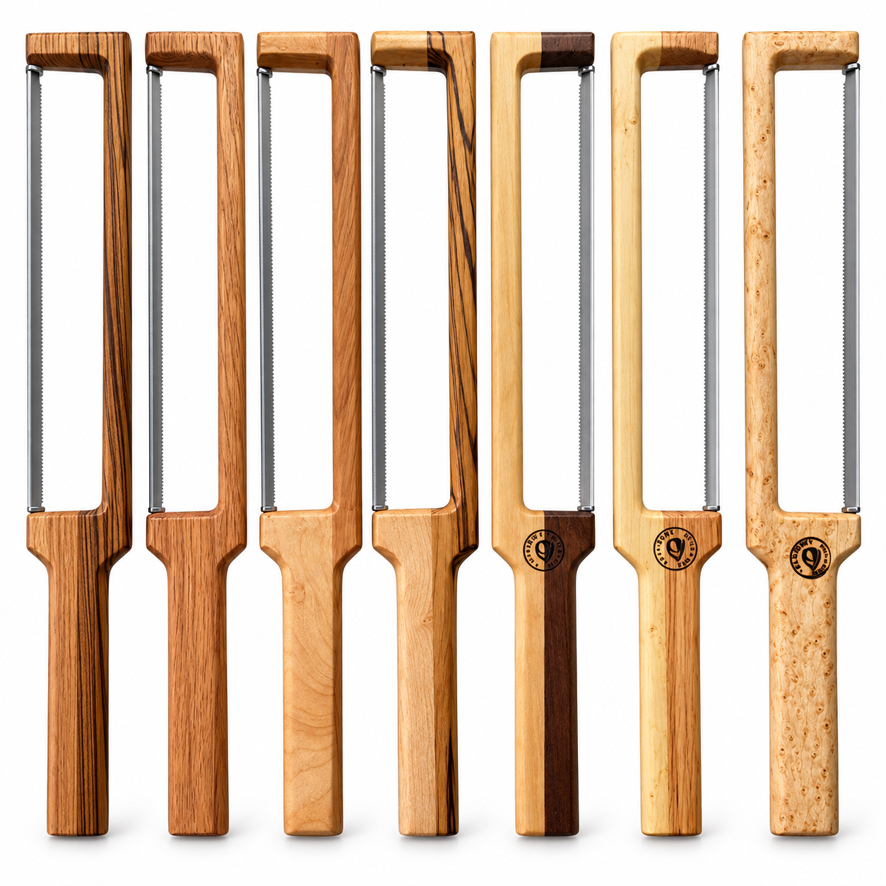 Seven bow knives lined up, each with a milled hardwood frame and serrated wire blade, in different wood species