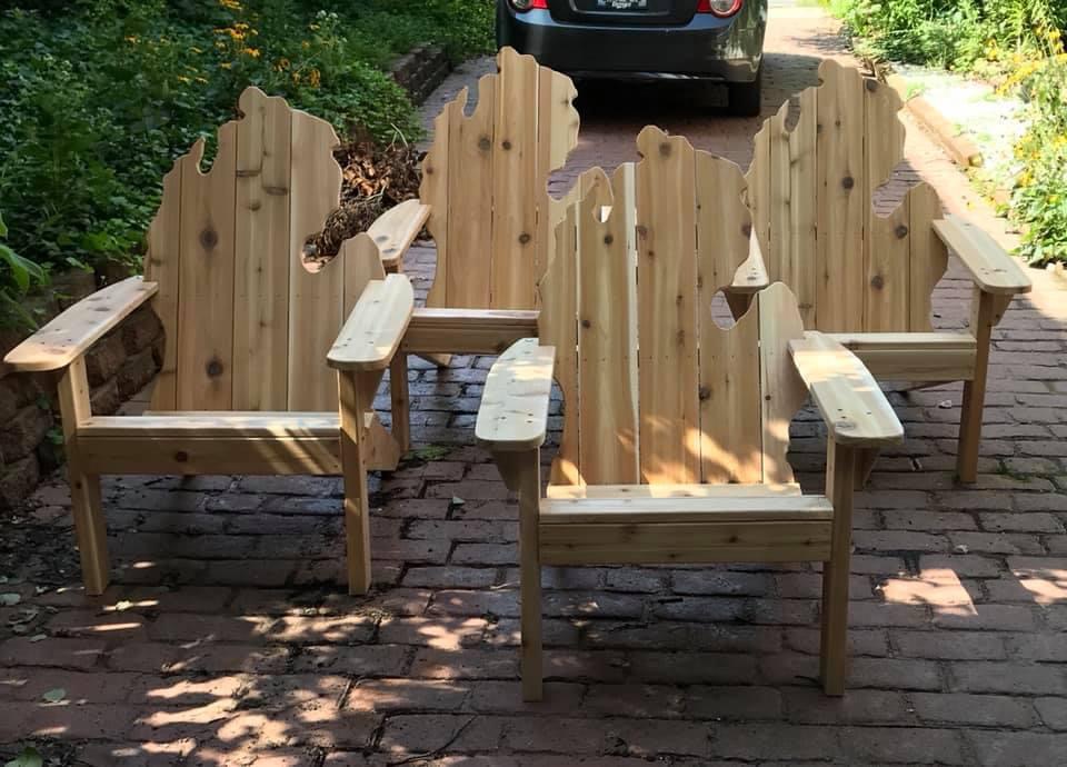 Cedar Adirondack chairs with backs cut in the shape of Michigan's lower peninsula